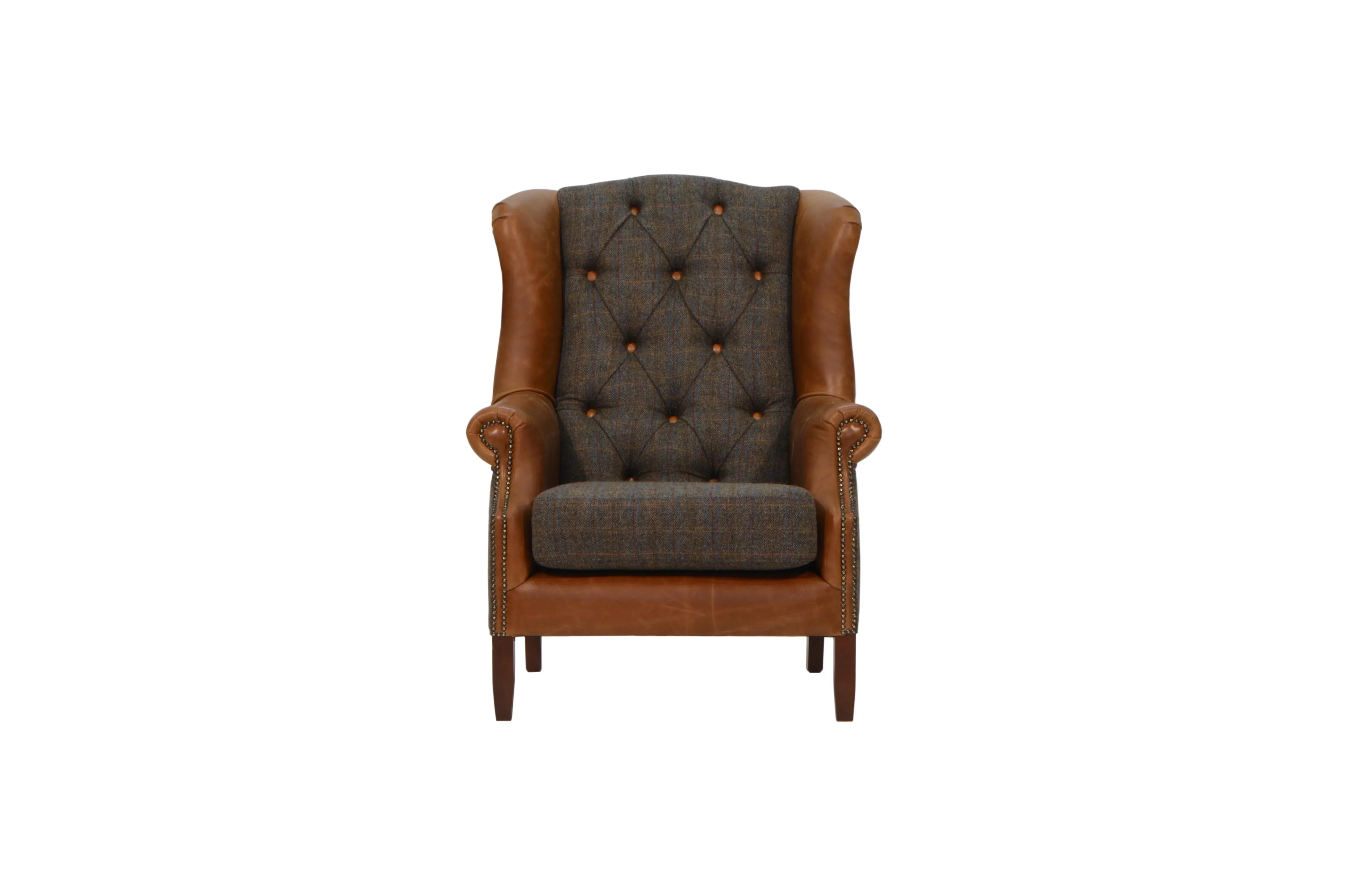 Brown leather armchair with tufted backrest and plaid fabric upholstery, front view