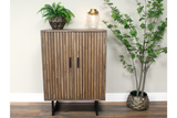 2 Door slatted wooden cabinet in light brown with black handles and legs, shown front view in a room setting.