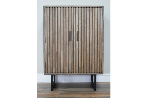 Two-door slatted wood cabinet in natural brown finish with black metal base, front view against white wall.