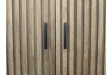 Close-up view of light brown wooden 2 door slatted cabinet with black vertical handles.