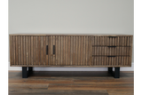 Low wooden TV sideboard with vertical slatted doors and drawers, black handles, black metal legs, front view.