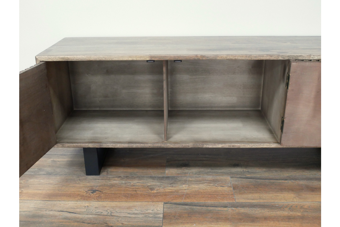 Wooden low sideboard slatted cabinet with open doors showing two interior compartments, black legs, on wooden floor.