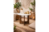 Round marble top side table with dark wooden base, shown in warm boho living room setting, front angle.