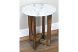 Small round side table with white marble top and three brown wooden legs, shown at slight angle on wood floor.