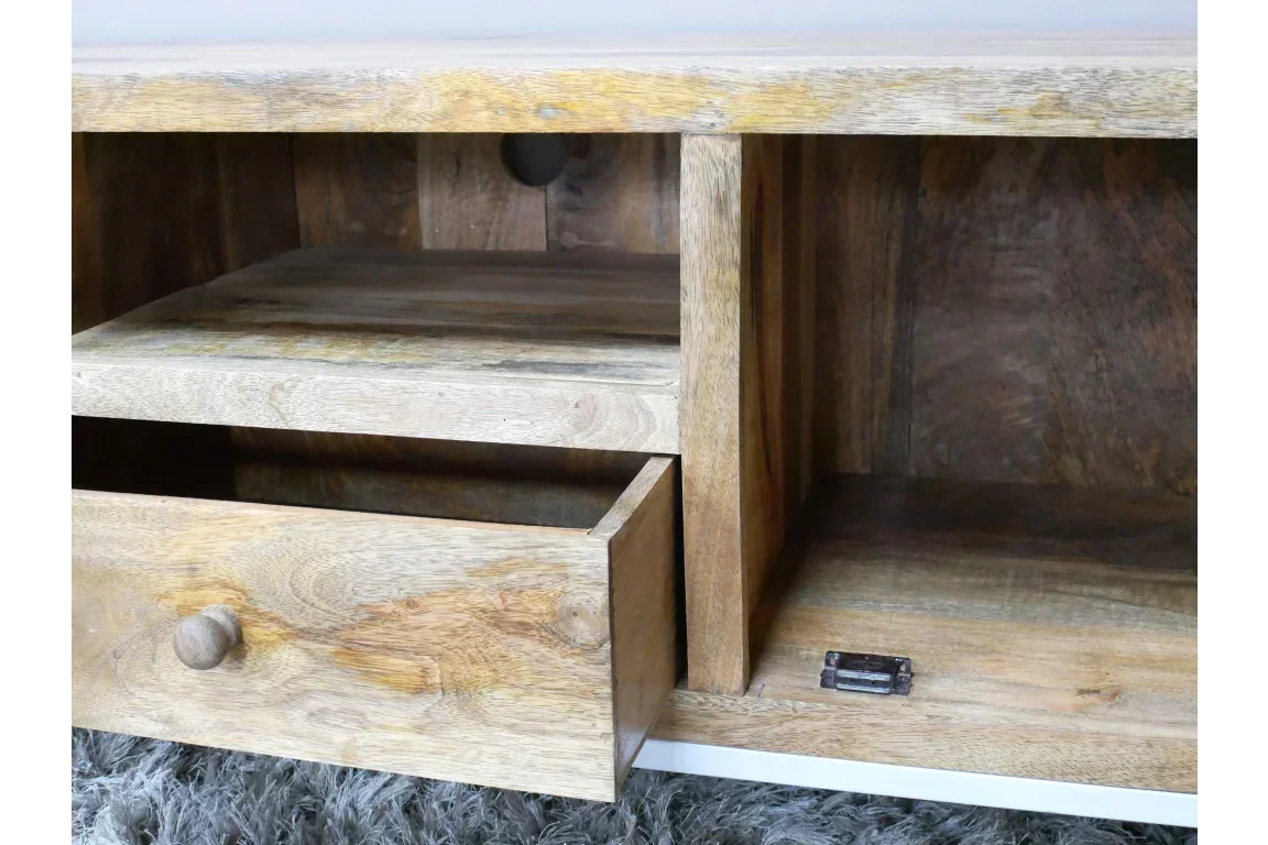 Mango wood TV unit with open drawer and storage shelf on textured rug