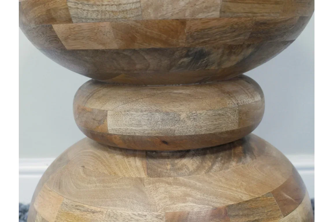 Close-up of acacia wood side table with rounded geometric stacked base