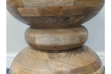 Close-up of acacia wood side table with rounded geometric stacked base