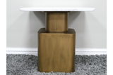 Side table with white marble top and gold rectangular base, photographed from front on gray carpet background.