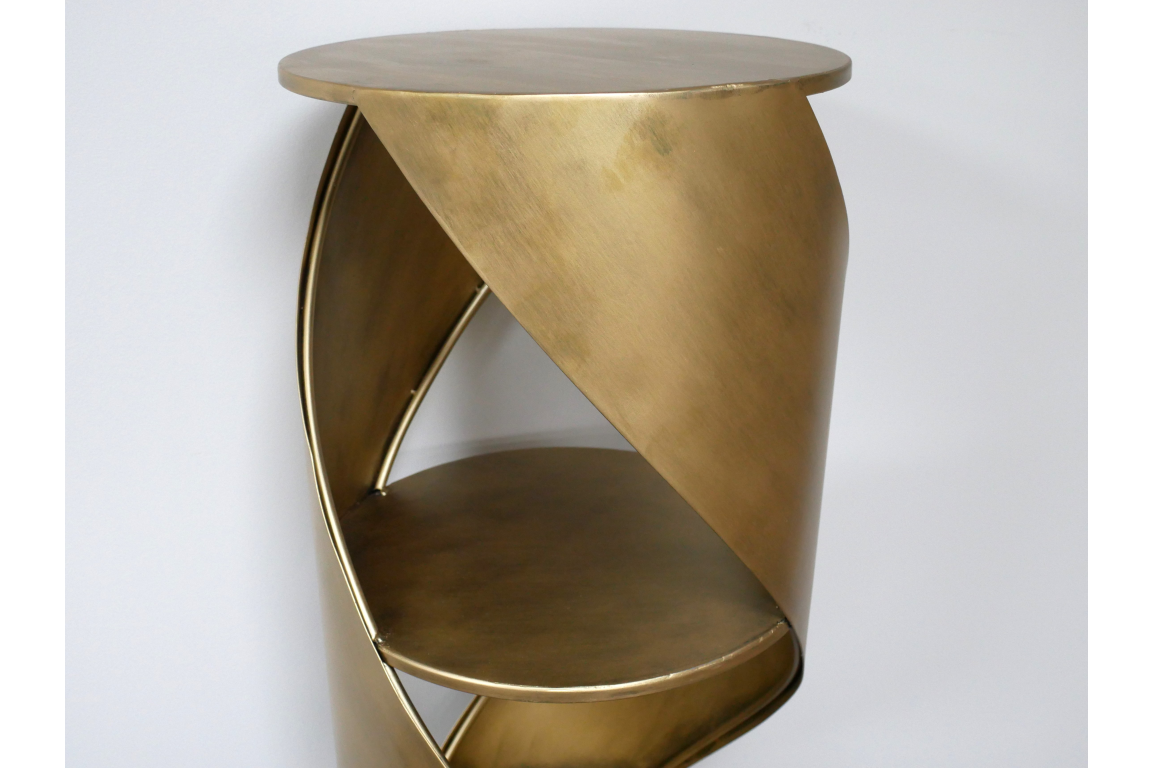 Swirl Display Cabinet, brass metal with a twisted cylindrical shape, two circular shelves, shown from front angle.