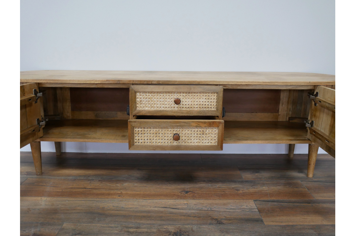 Wooden TV cabinet with two open side doors and two front drawers featuring woven rattan panels, front view.