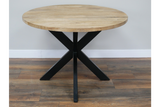 Round wooden dining table with light natural finish and black metal X-shaped base, front angle view on wooden floor.