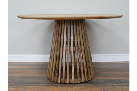Round wooden dining table with slatted conical base, natural wood finish, viewed front on against neutral wall.