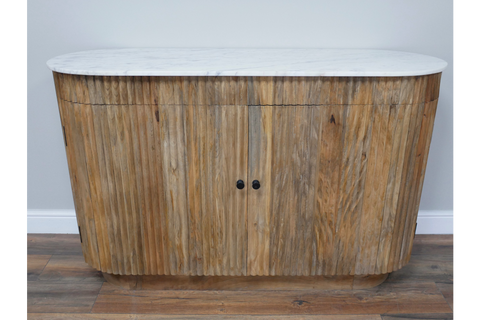 Wooden sideboard with vertical slats and rounded edges, topped with a white marble surface, front view.