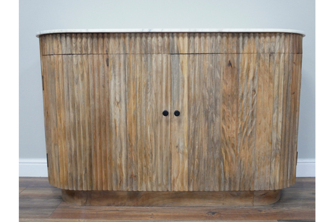 Curved wooden sideboard with vertical slats, natural finish, black knobs, and white marble top, front view.