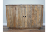 Curved wooden sideboard with vertical slats, natural finish, black knobs, and white marble top, front view.