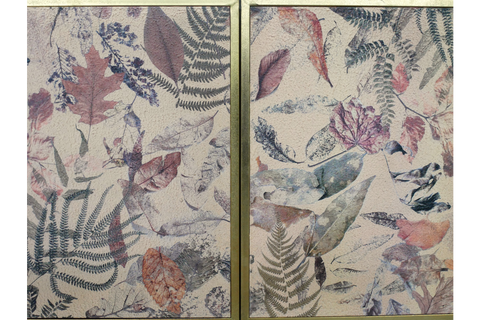 Small rectangular cabinet with two doors featuring a pressed leaf pattern in muted greens, purples, and browns on cream