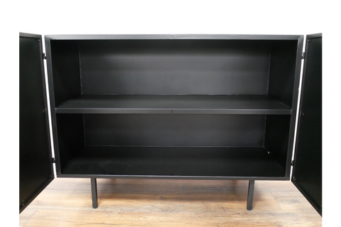 Small black metal cabinet with two open doors, one interior shelf, and four legs on wooden floor