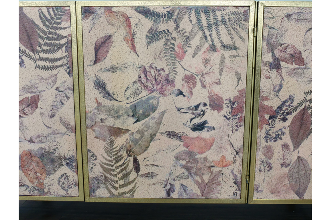 Large cabinet with three doors, gold frame, and multi-colored leaf pattern on textured surface, front view.