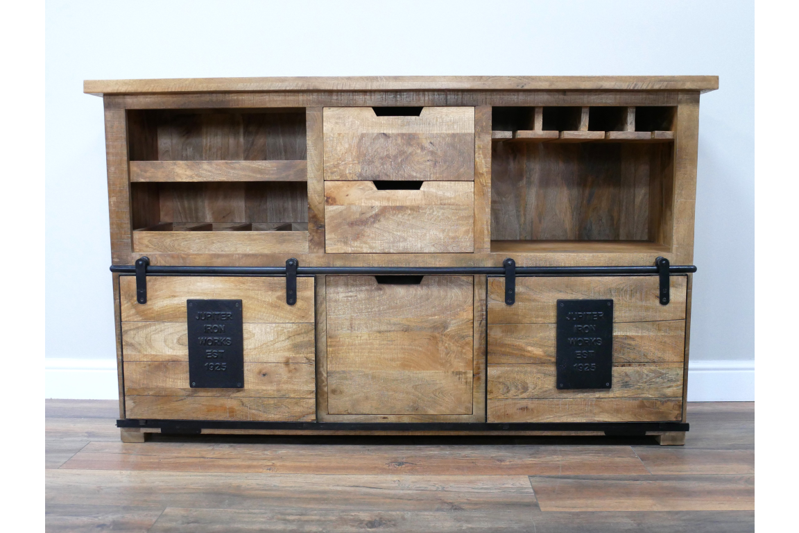 The Jupiter Wine Cabinet features a rustic wooden design with multiple storage compartments, including drawers and wine bottle slots, complemented by metal accents