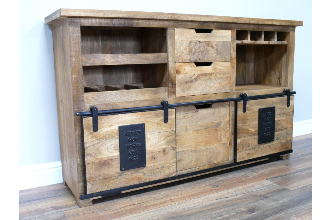 The Jupiter Wine Cabinet features a rustic wooden design with multiple shelves, drawers, and a sliding door, perfect for storing wine and accessories
