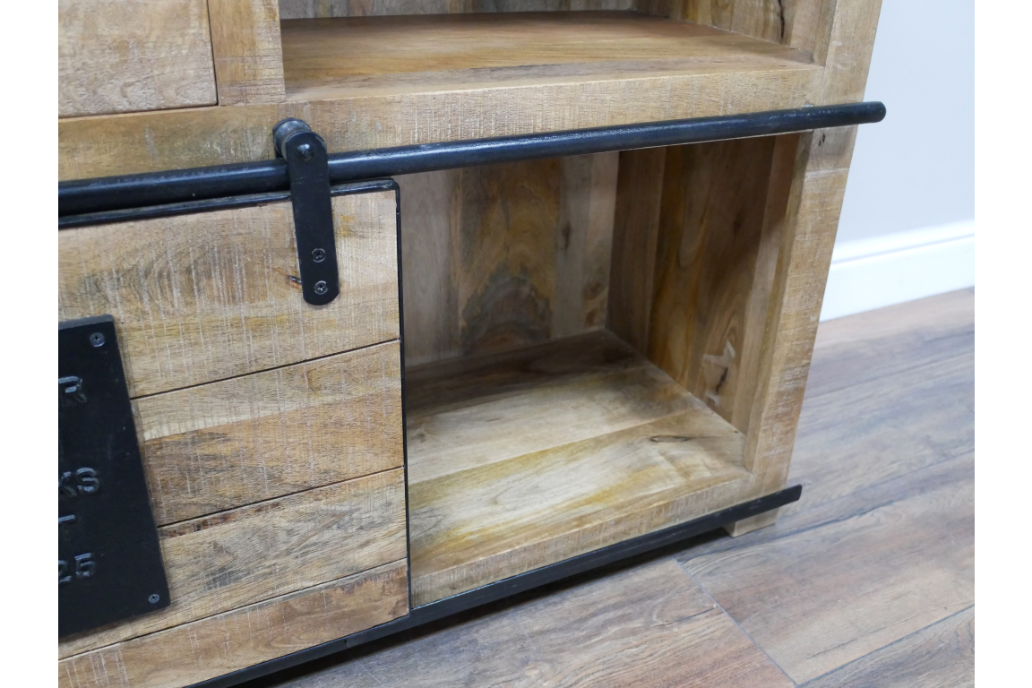 The Jupiter Wine Cabinet features a rustic wooden design with a metal handle, showcasing an open shelf and a closed compartment for storage