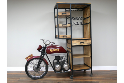 Motorbike bar cabinet with wooden shelves and drawers, black metal frame, and wine glass holders, side angle view.