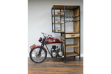 Motorbike-shaped bar cabinet with red metal front bike and wooden shelves with black metal frame, angled view.