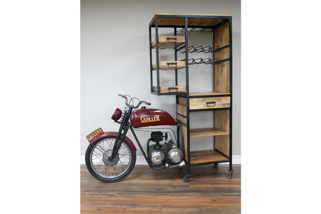 Motorbike-shaped bar cabinet with red metal front bike and wooden shelves with black metal frame, angled view.