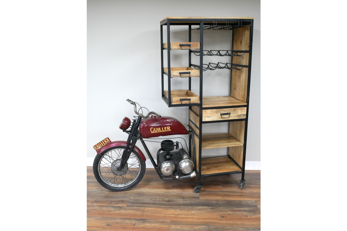 Motorbike bar cabinet with red metal motorcycle front, black metal frame, wooden shelves, drawers, and wine racks, side view.