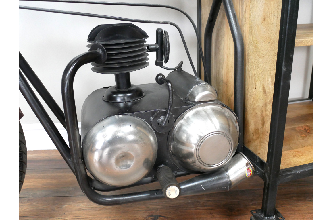 Close-up of motorbike bar cabinet black metal frame with silver metallic engine detail on wooden floor
