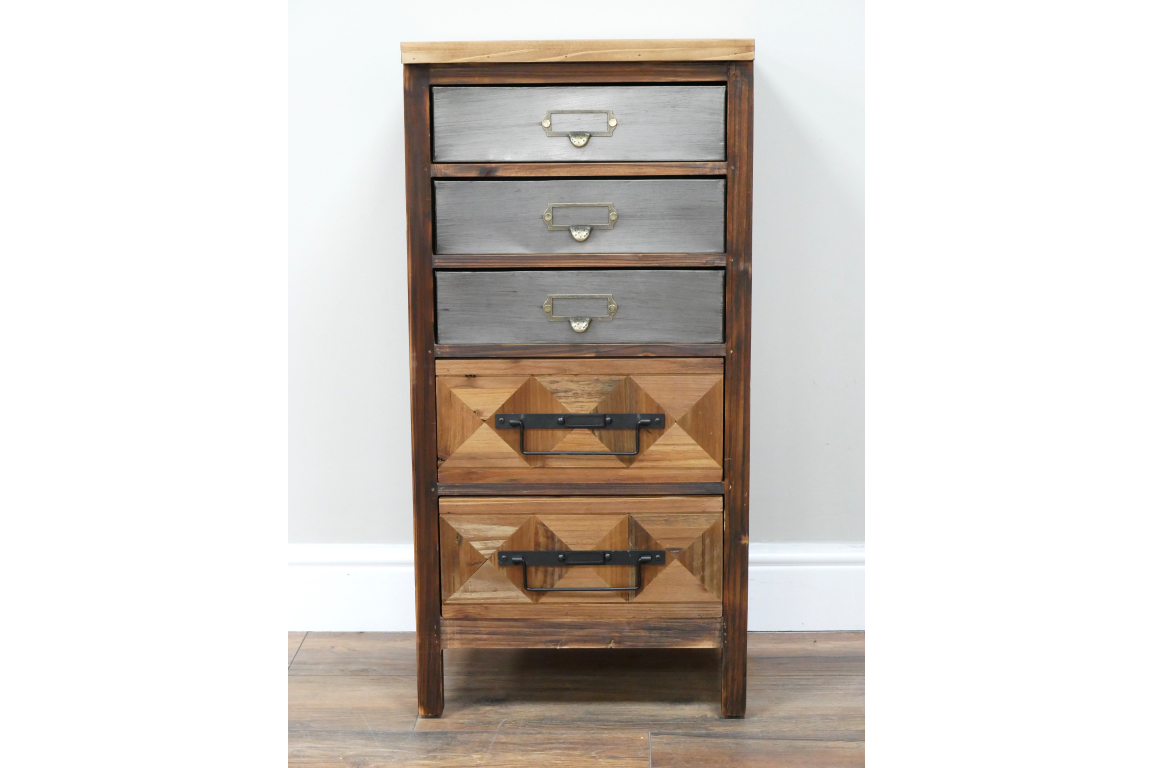 The rustic cabinet features a wooden frame with a natural finish, four drawers in varying shades of gray and brown, and decorative metal handles for a charming, vintage look