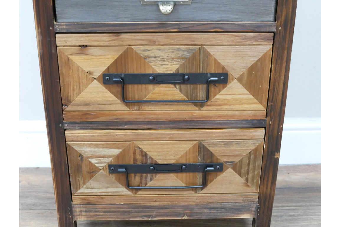 The rustic cabinet features a wooden design with a diamond pattern on the drawers, complemented by black metal handles for a charming, vintage look