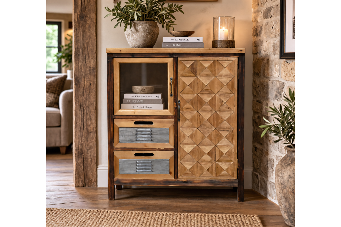 The rustic cabinet features a wooden frame with a geometric patterned door, a glass display section, and two gray drawers, perfect for stylish storage