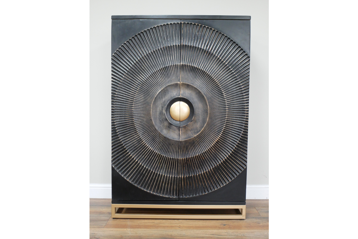The Solstice Wine Cabinet features a sleek black exterior with a striking circular design and a gold accent knob, resting on a minimalist gold base