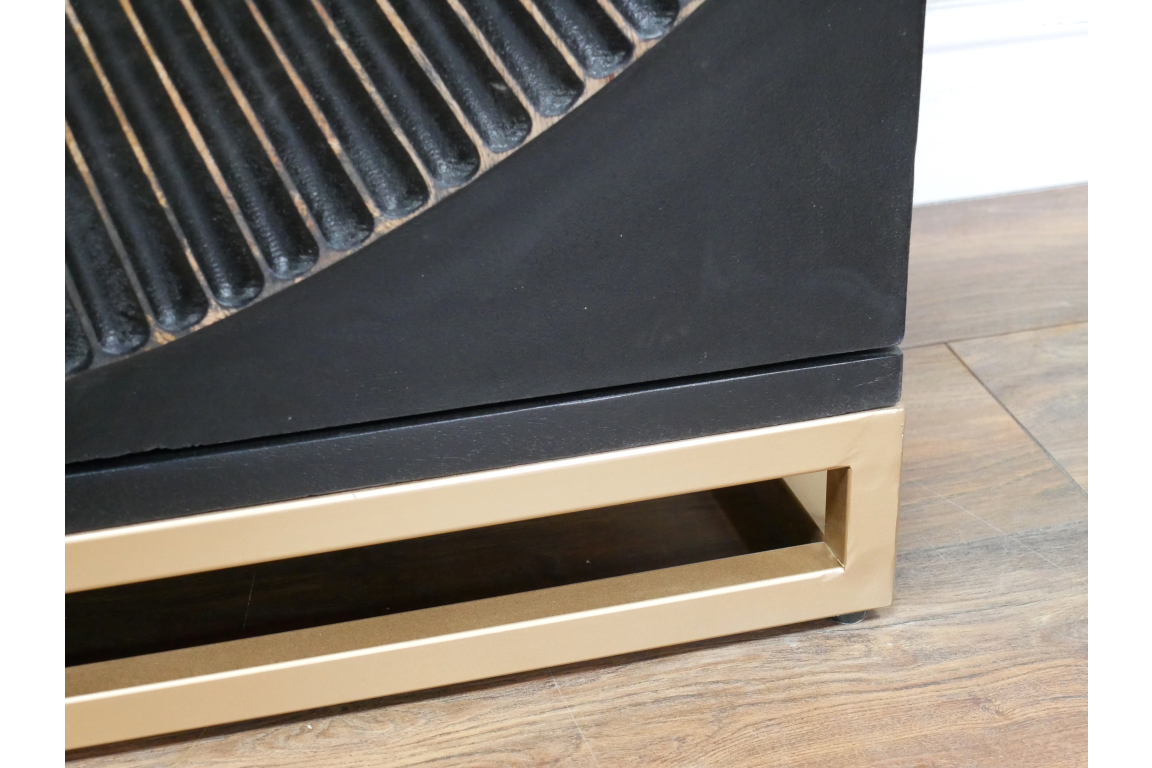 The Solstice Wine Cabinet features a sleek black finish with a textured design on the door and a stylish gold base, perfect for storing and displaying wine