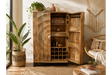 The natural wood wine cabinet features a unique carved design, multiple shelves for bottles and glasses, and an open space for decorative items, enhancing any living space