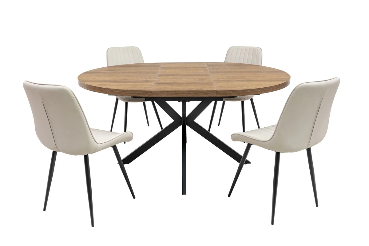 Wooden round dining table with black metal legs and four beige upholstered chairs