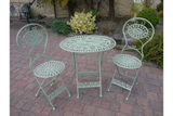 Green metal garden bistro set with round table and two chairs on patio