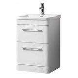 White bathroom vanity unit with two drawers and chrome handles, integrated basin and tap