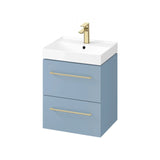 Blue bathroom vanity unit with gold handles and white basin, front view