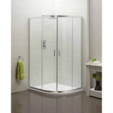 Corner shower enclosure with glass doors and chrome frame in modern bathroom