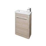 Light wood bathroom vanity unit with white basin and chrome tap