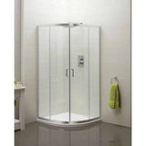 Corner shower enclosure with glass doors and chrome frame in modern bathroom