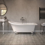White freestanding bath with chrome feet in modern bathroom with patterned floor tiles