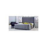 Grey velvet bed frame with vertical panel headboard in modern bedroom setting