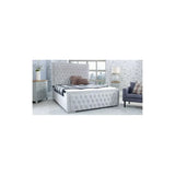 Grey upholstered bed frame with tufted headboard in modern bedroom setting