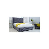 Grey upholstered bed frame with tufted headboard in modern bedroom