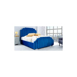Blue velvet bed frame with vertical panels in modern bedroom setting