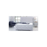 Grey upholstered bed with button-tufted headboard in modern bedroom setting
