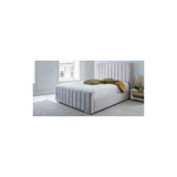 Grey upholstered bed frame with vertical panel headboard in modern bedroom
